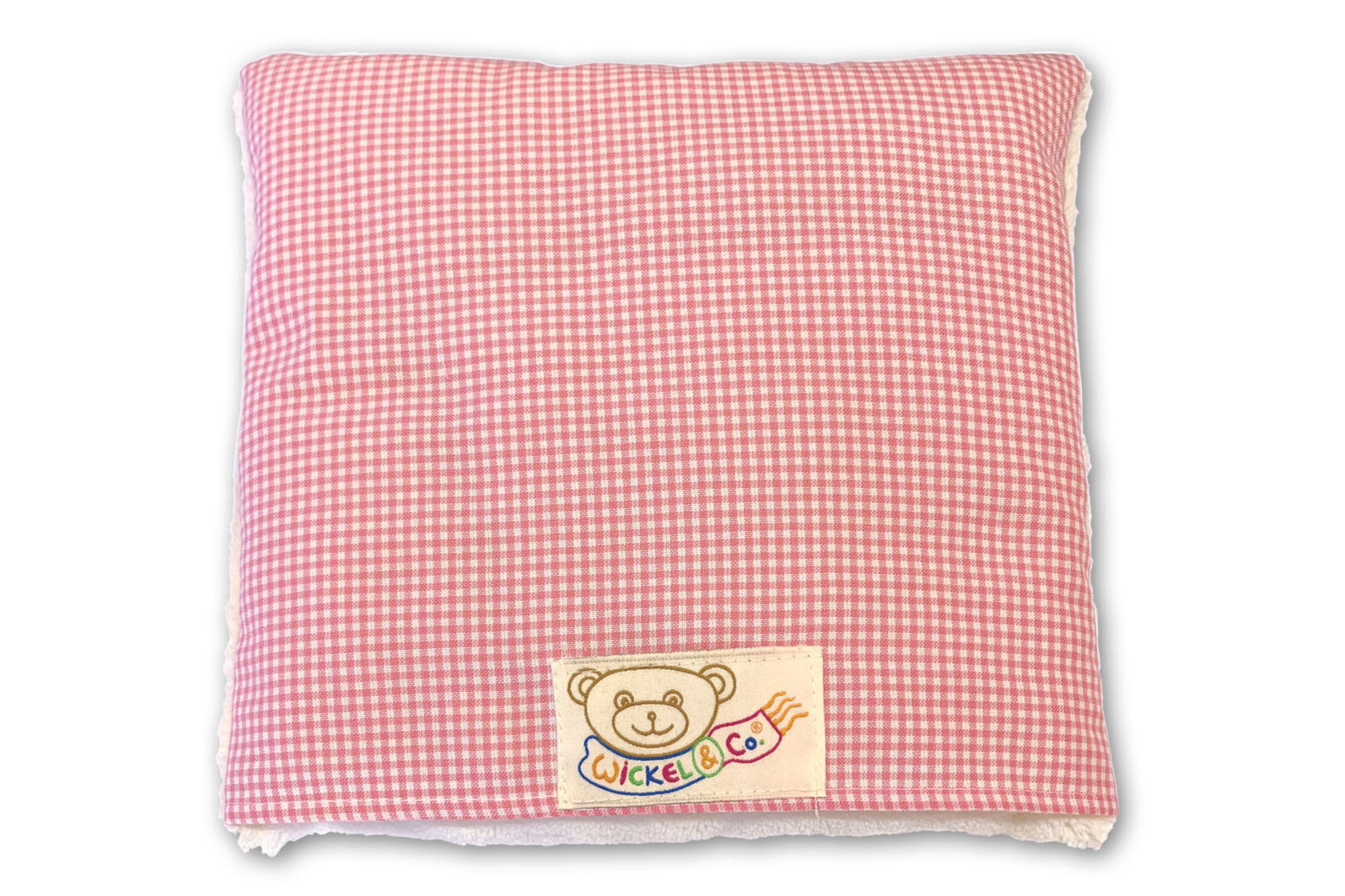 Cuddly pillow with plush and healing wool